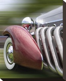 Duesenberg in Motion Stretched Canvas Print by Richard James