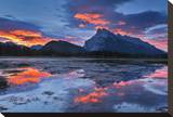 Mount Rundle Reflected in Vermillion Lake Stretched Canvas Print by Mike Grandmaison