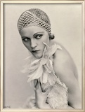 Portrait of a Woman Wearing a Fishnet Hat and a Feather Boa Framed Photographic Print by Wanda Wulz