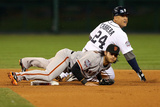 Detroit, MI - Oct 27: Detroit Tigers v San Francisco Giants - Brandon Crawford and Miguel Cabrera Photographic Print by Ezra Shaw
