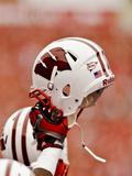 University of Wisconsin: Wisconsin Badgers Helmet in the Air Photographic Print