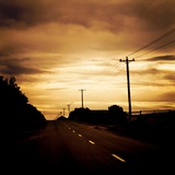 A Road with White Lines and Telephone Poles Photographic Print by Mark James Gaylard