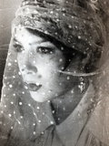 A Young Womans Face Covered in Netting Photographic Print by Leonora Saunders