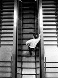 A Man on an Escalator Photographic Print by Rip Smith
