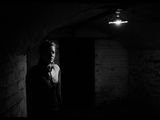 A Young Woman Waiting in a Dark Room Photographic Print by Leonora Saunders