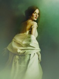 A Woman in a White Evening Dress, Standing by the Wall and Looking at the Viewer Photographic Print by Malgorzata Maj