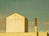 A Small White House with No Windows and a Chimney Photographic Print by Susan Bein