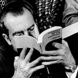 Pres Richard Nixon Looks at His Economic Report to Congress During Signing Ceremony, Feb 1, 1974 Photographic Print