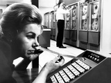 Woman Holds Tape with the Latest Stock Prices Printed by the Quotron II Photographic Print