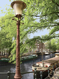 Old Gas Lamp Post and Bicycles on a Bridge over a Canal in Amsterdam, the Netherlands Photographic Print by Miva Stock