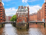 Waterfront Warehouses in the Speicherstadt Warehouse District of Hamburg, Germany Photographic Print by Miva Stock