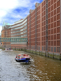 Boats Pass by Waterfront Warehouses and Lofts, Speicherstadt Warehouse District, Hamburg, Germany Photographic Print by Miva Stock