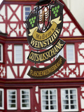 A Traditional Sign for a Wine Tavern or Bar in Bernkastel-Kues, Germany Photographic Print by Miva Stock