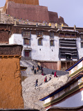 Tibetan Pilgrims Climbing to a Temple in Palkhor Monastery, Gyantse, Tibet, China, Asia Photographic Print by Nancy Brown