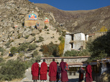 Monks Looking at Sacred Rocks at Drepung Monastery in Tibet, China, Asia Photographic Print by Nancy Brown