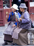 Two Buddhist Pplgrim Women Sitting on Barkor Street, Lhasa, Tibet, China, Asia Photographic Print by Nancy Brown