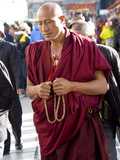 Monk in Barkor Street in Lhasa, Tibet, China, Asia Photographic Print by Nancy Brown
