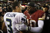 NFL Playoffs 2013: Seahawks vs Redskins - Robert Griffin III and Russell Wilson Photographic Print by Evan Vucci