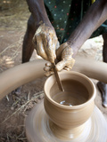 Hands of Village Potter Using Tool to Shape Clay Pot, Near Rayagada, Orissa, India Photographic Print by Annie Owen