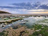Sunset over Rocks and Pools at Dunraven Bay, Southerndown, Wales Photographic Print by Chris Hepburn