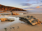 Sunset over Rocks with Flowing Water at Dunraven Bay, Southerndown, Wales Photographic Print by Chris Hepburn