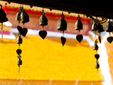 Close Up of Prayer Bells Silhouetted Against Colourful Roof at Wat Doi Suthep, Chiang Mai, Thailand Photographic Print by Matthew Williams-Ellis