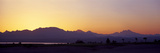 Silhouette of a Golf Course with Sinai Mountains in the Background, the Cascades Golf and Country . Photographie par Panoramic Images 