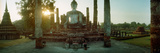 Statue of Buddha at Sunset, Sukhothai Historical Park, Sukhothai, Thailand Photographic Print by Panoramic Images 