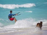 A Kiteboarder and His Dog Enjoying Gusty Winds from Hurricane Tomas Photographic Print by Mike Theiss