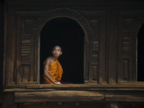 A Monk Out from the Windows of a Wooden Monastery in Myanmar Photographic Print by Alex Treadway