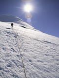 A Man Hikes Up on Mount Osorno, Chile Photographic Print by Greg Winston