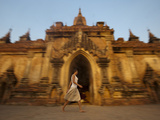 A Tourist Walks Past One of the Ancient Temples at Bagan Photographic Print by Alex Treadway