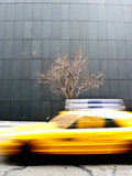 A Taxi Passes by in a Blur Photographic Print by Jorge Fajl