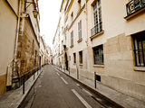 A Small Street Lined with Traditional Parisian Buildings Photographic Print by Jorge Fajl