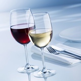 Glass of White Wine and Glass of Red Wine Beside Place-Setting Photographic Print by Alexander Feig