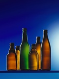 Assorted Beer Bottles Against Blue Background Photographic Print by Bodo A. Schieren
