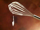 A Whisk with Whipped Cream Photographic Print by Ludger Rose