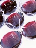 Six Glasses of Red Wine Against White Background Photographic Print by Linda Burgess