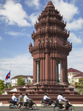 Motorcycles Passing Independence Monument, Phnom Penh, Cambodia Photographic Print by Ian Trower