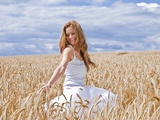 Young Woman in Barley Field Photographic Print by Marco Müller