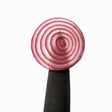 A Slice of Red Onion on a Knife Photographic Print by Alexander Feig