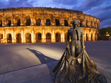 France, Provence, Nimes, Roman Ampitheatre, Toreador Statue at Dusk Photographic Print by Shaun Egan