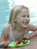 Small Girl with Fresh Fruit at the Pool Photographic Print by Louise Hammond