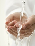 Hands under Running Water Photographic Print