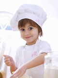 Little Girl Mixing Pastry Ingredients Photographic Print