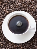Cup of Black Coffee on Coffee Beans Photographic Print