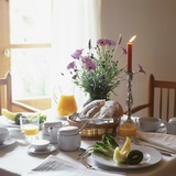 Laid Breakfast Table with Baked Goods, Juice and Fruit Photographic Print