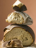 Rustic Bread, Two Loaves with Pieces Cut Off in a Pile Photographic Print