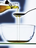 Olive Oil Flowing into a Bowl Photographic Print by Hermann Mock
