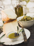 Cheese, Olives and Olive Oil on Table Out of Doors Photographic Print